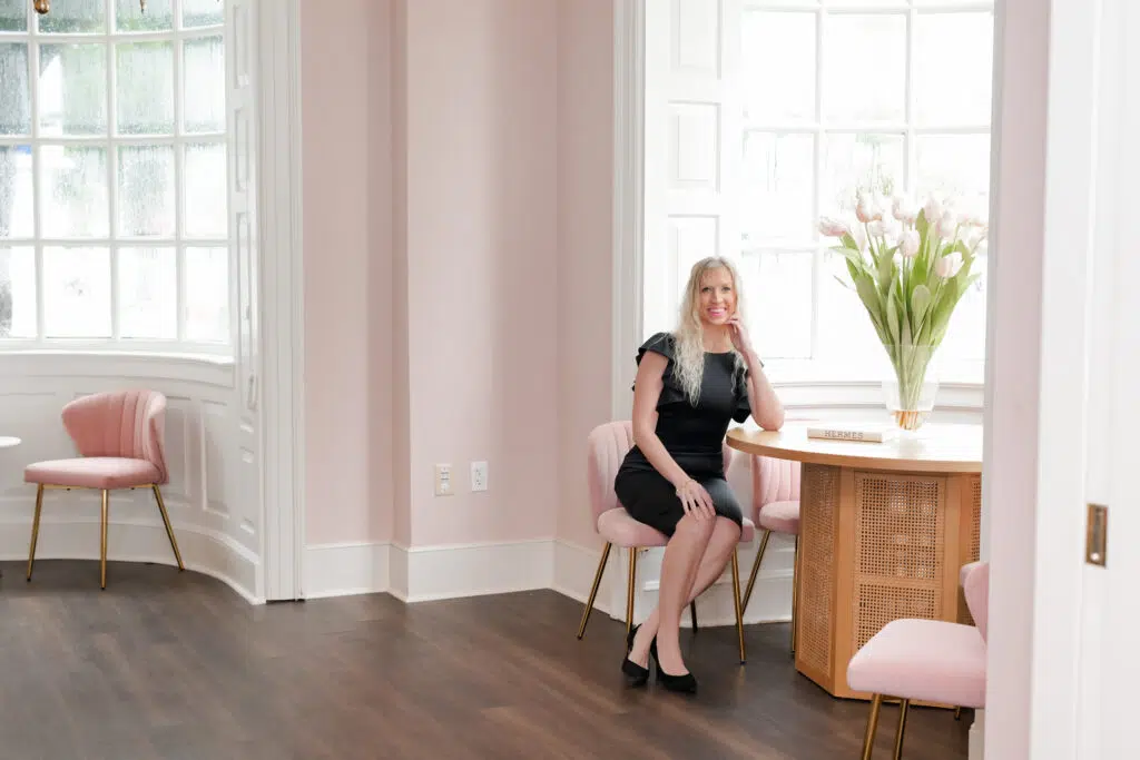 Elle Rudisill sitting near a table