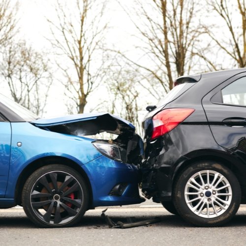 car accident between blue and black car